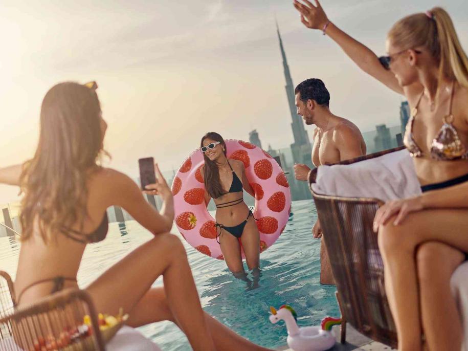 People partying in SLS Dubai Privilege Pool 