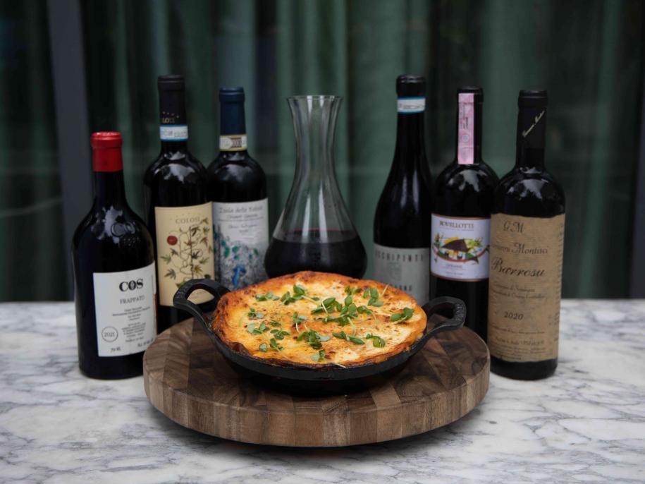 Lasagna and wine bottle on a table