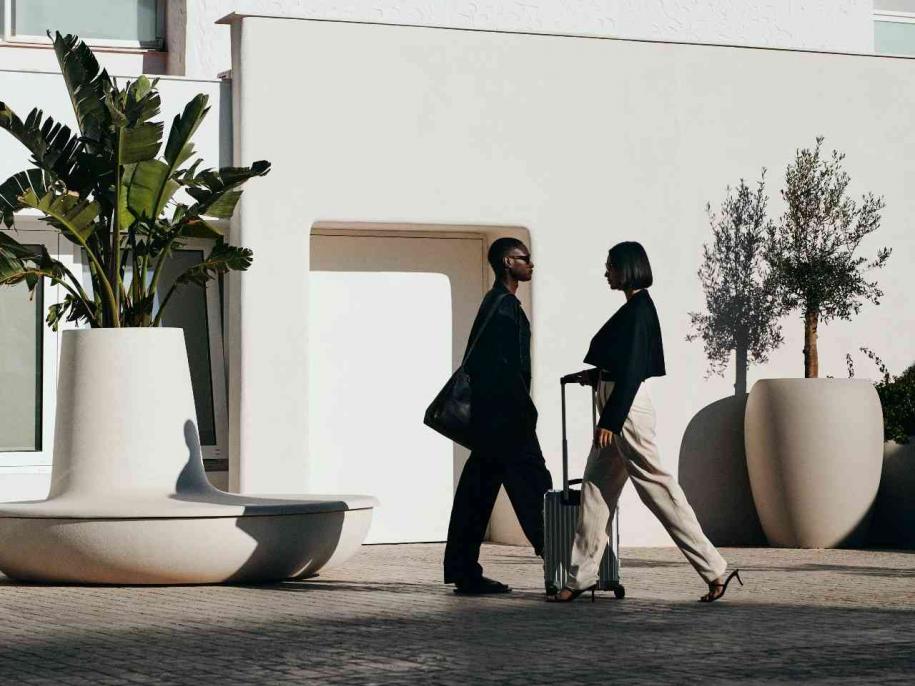 two people walking outside wearing black and white