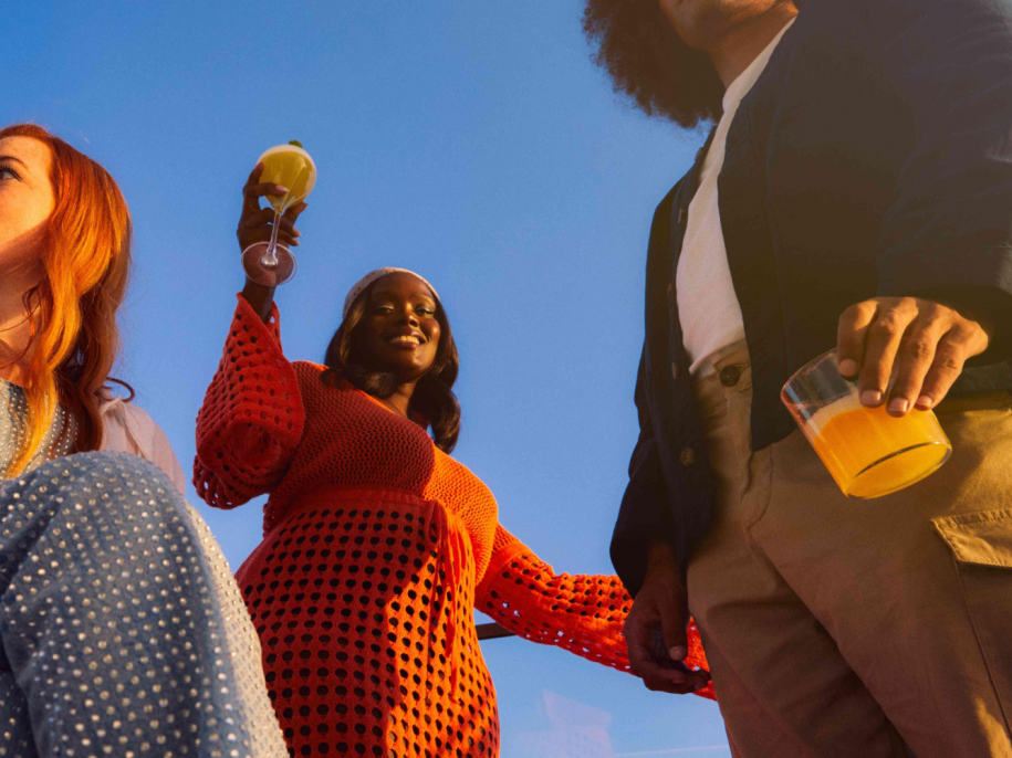 three people have drinks and a good time