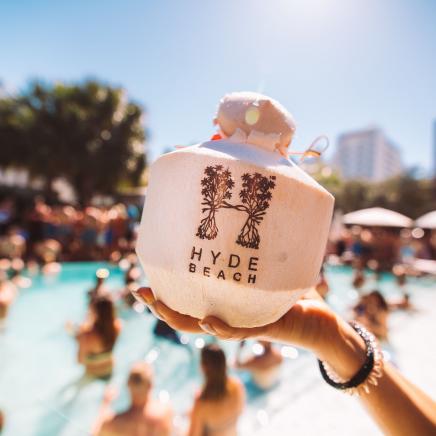 hand holding a coconut drink