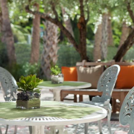 exterior garden area at Hyde Beach with patio tables