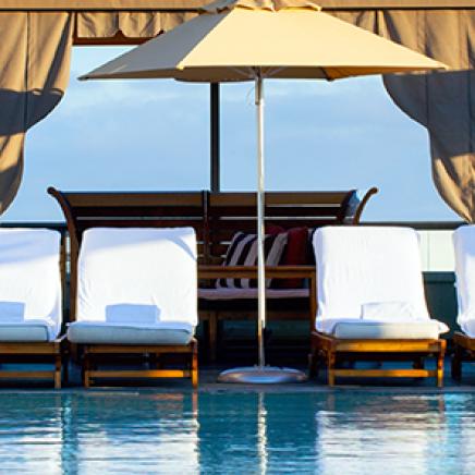 Cabanas surrounding a tropical pool