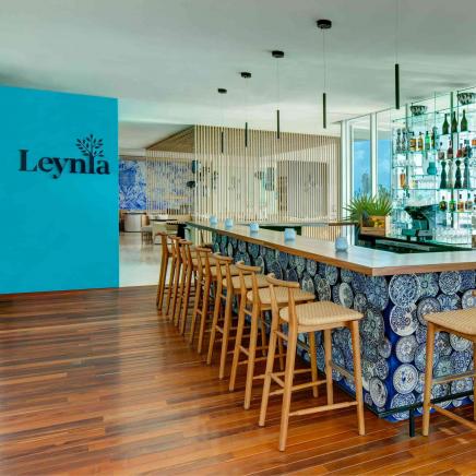 Inside Bar with wicker bar stools leading to Leynia
