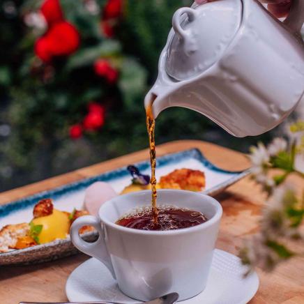 tea being poured into tea cup