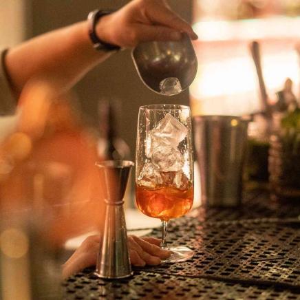 A cocktail being poured 