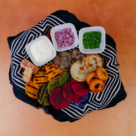 root vegetable cakes and dip and small diced chives and red onion