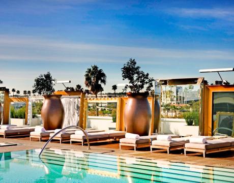 a rooftop pool with cabanas