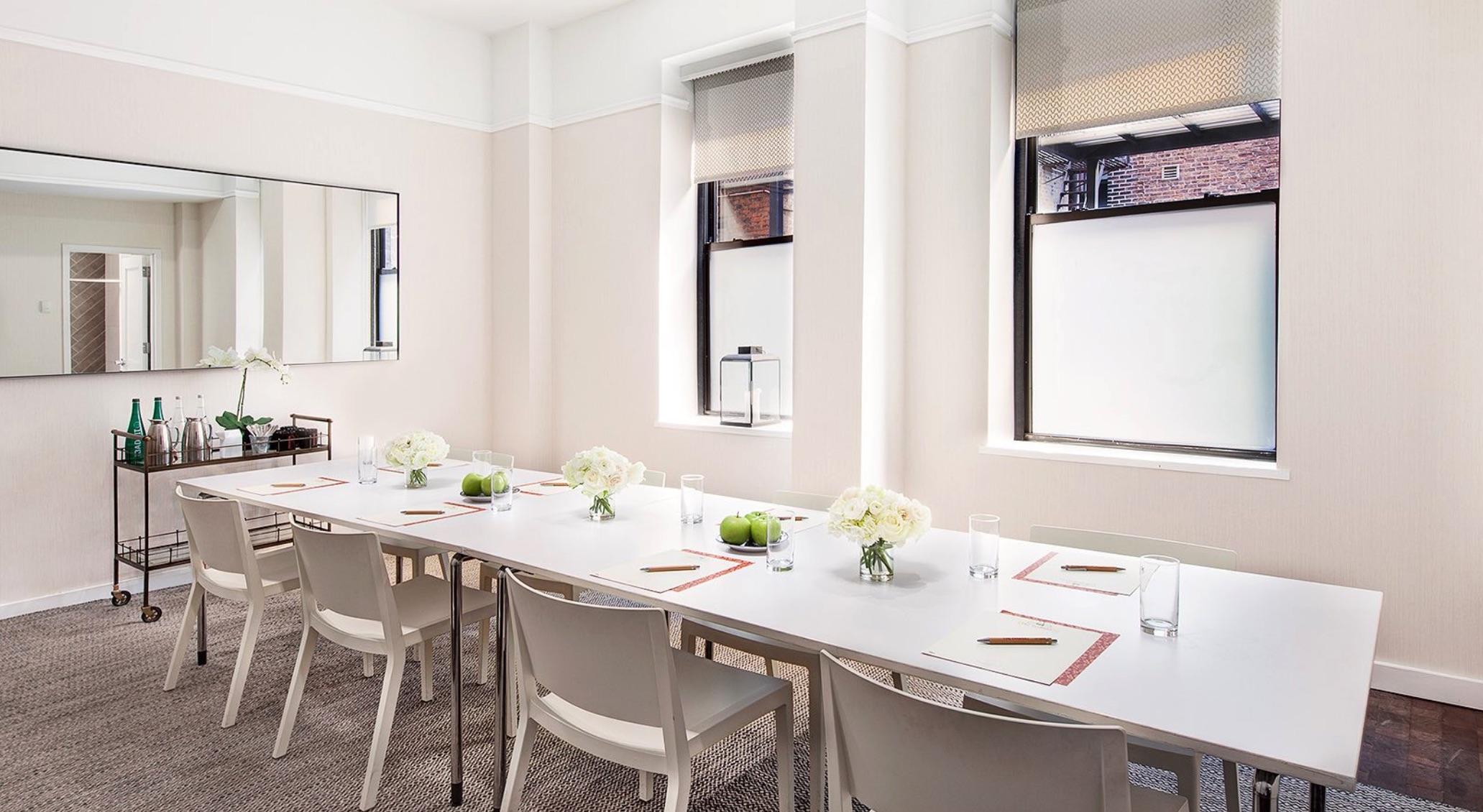 white conference room table and chairs at Redbury New York