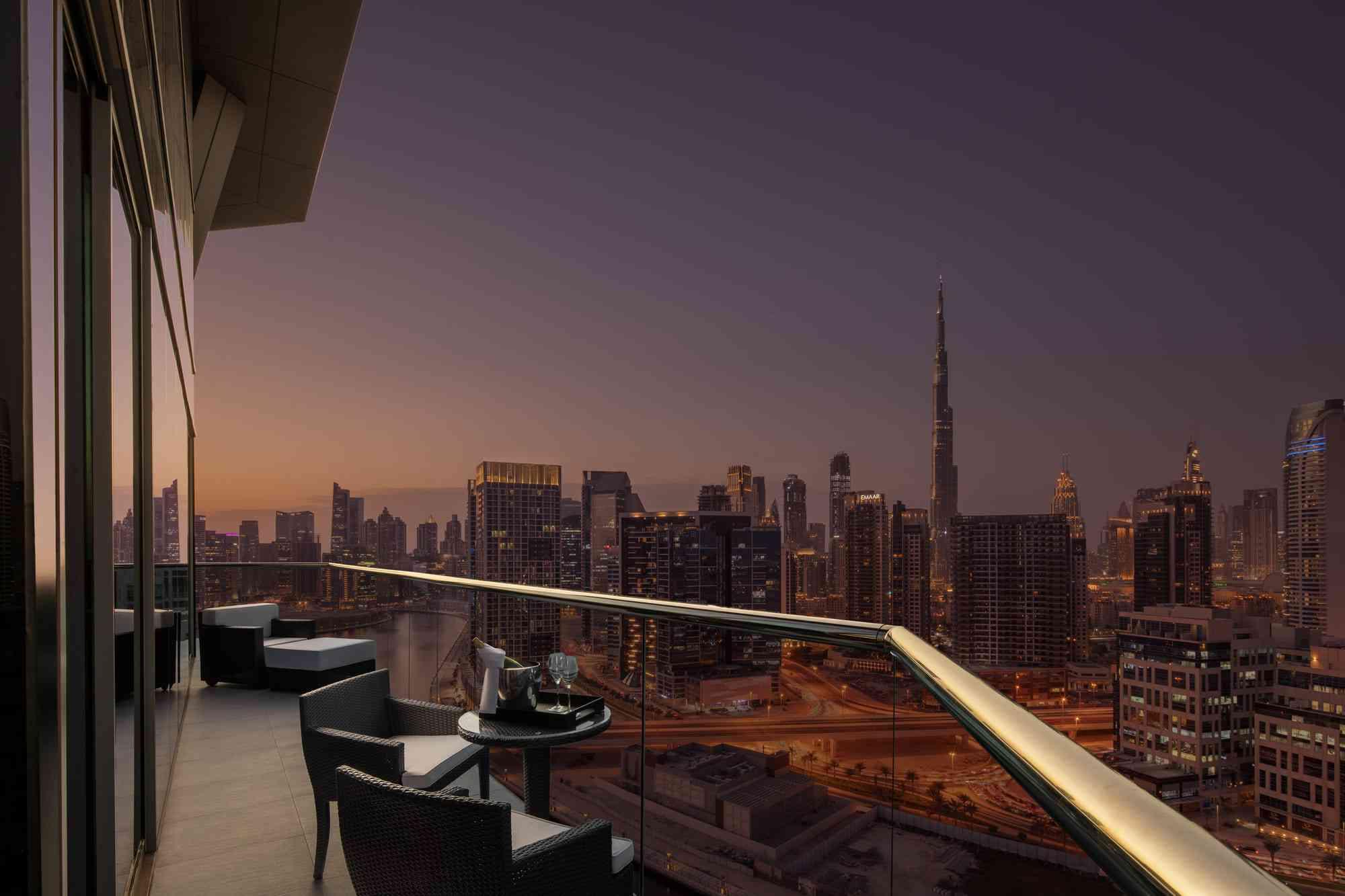 Balcony looking out at Dubai at night.