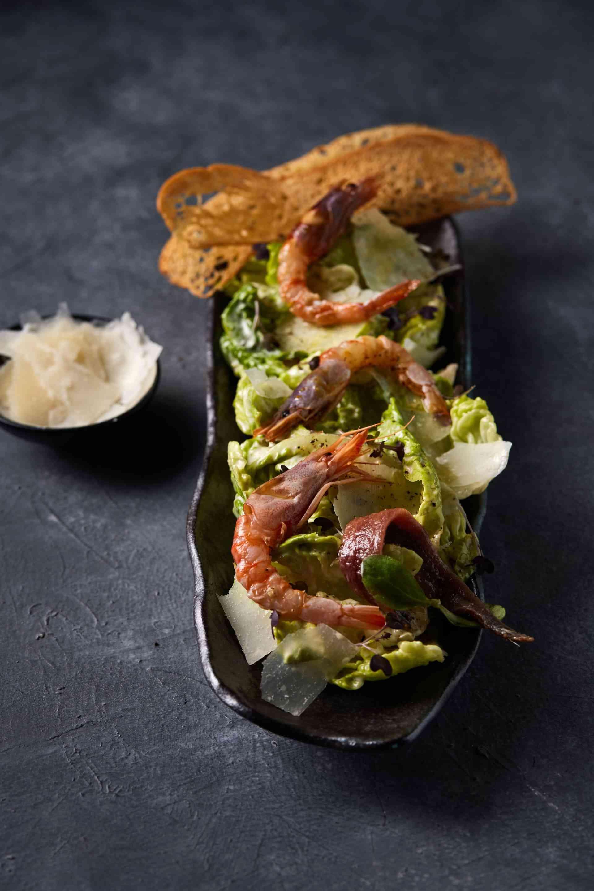 Shrimp salad with a side dish of cheese