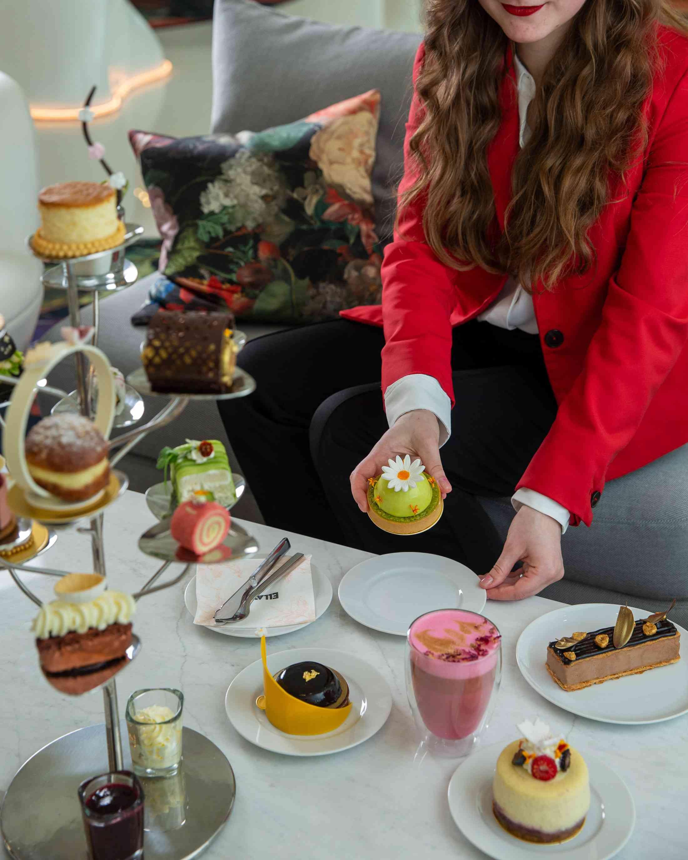 A woman plating desserts