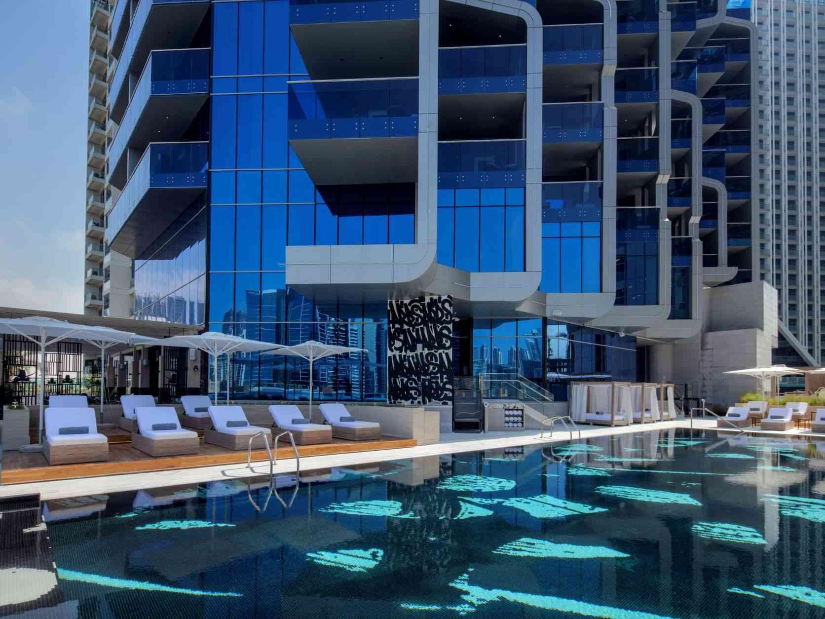 Hyde Hotel Dubai outdoor pool and chairs