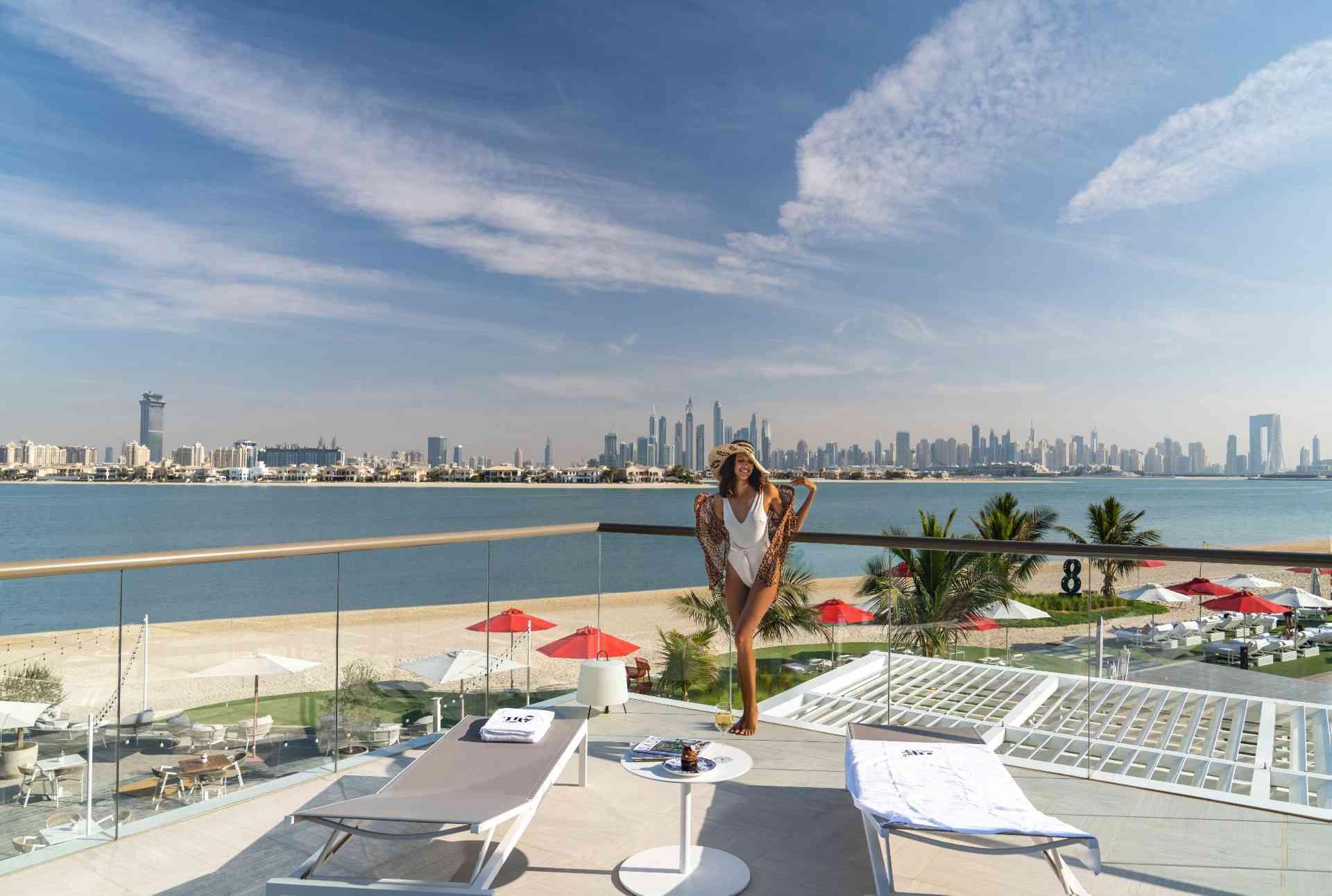Woman in bathing suit in front the Th8 Dubai 