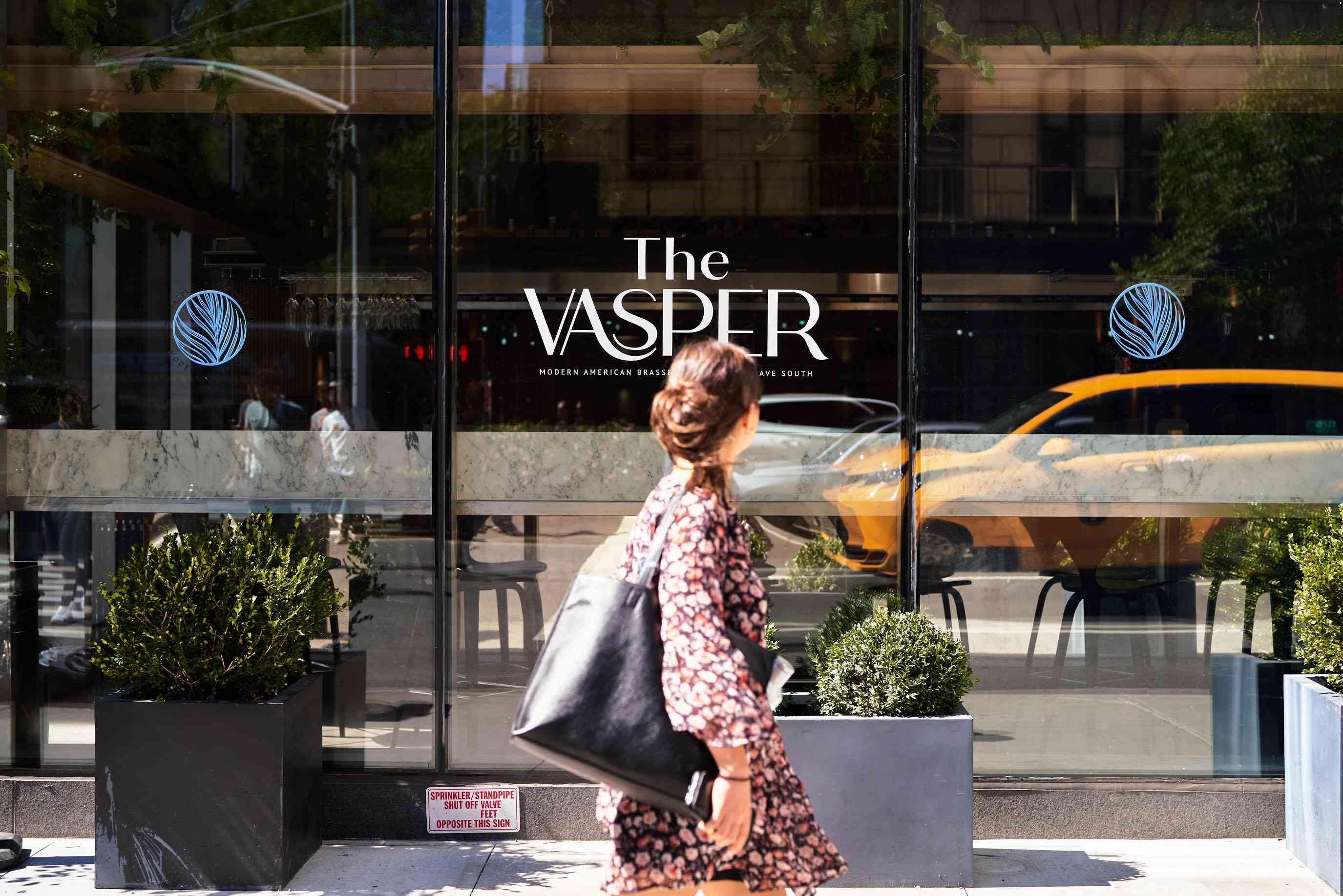 Woman walking by The Vasper 