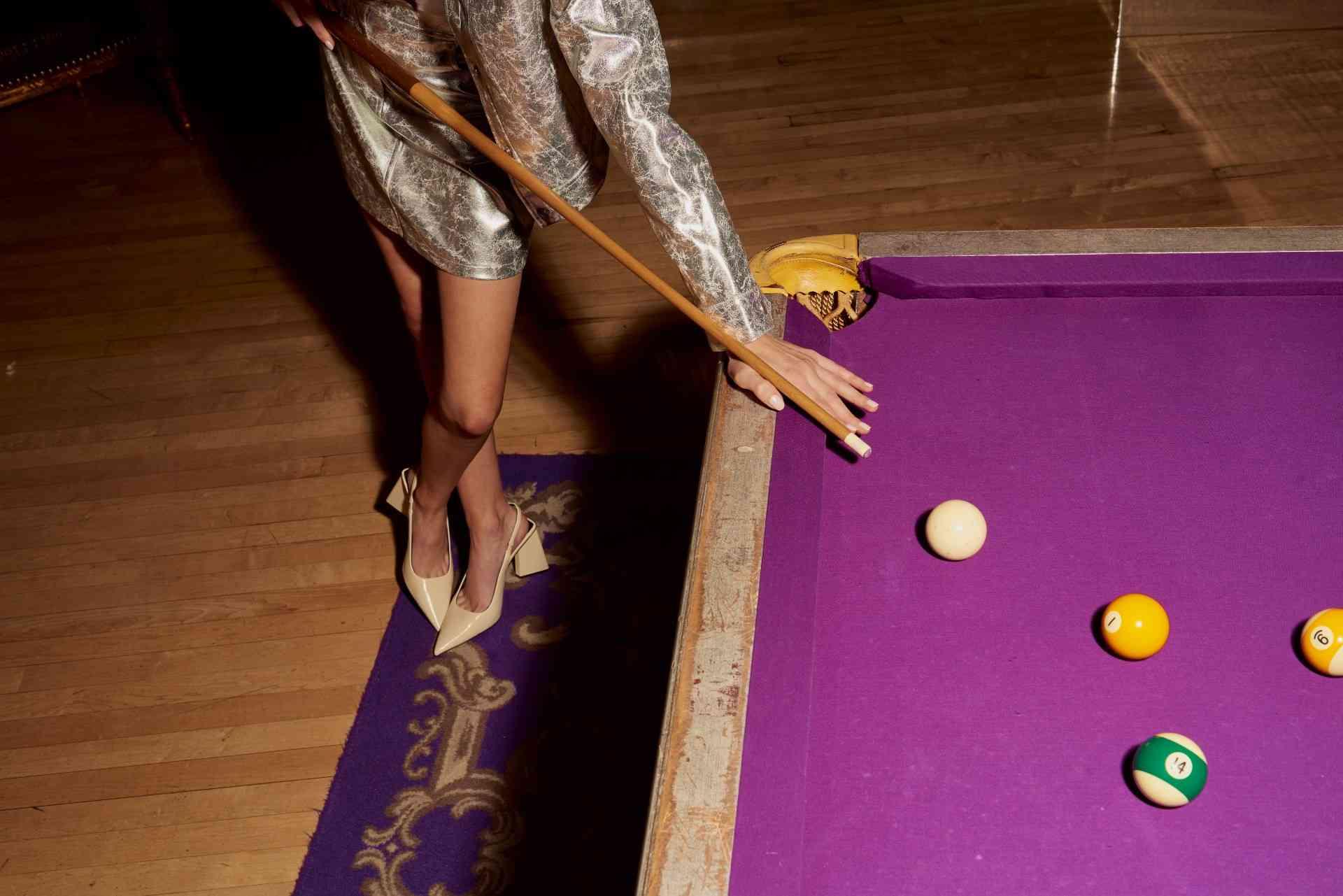 Woman plays pool