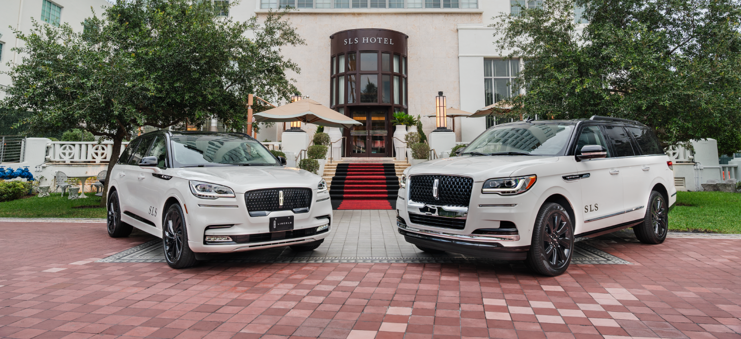 Two White SUV Lincolns