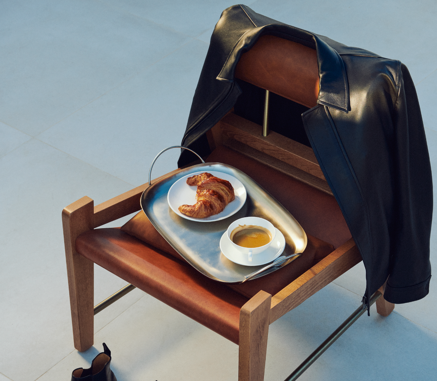 chair with a tray of breakfast food and drinks on it 