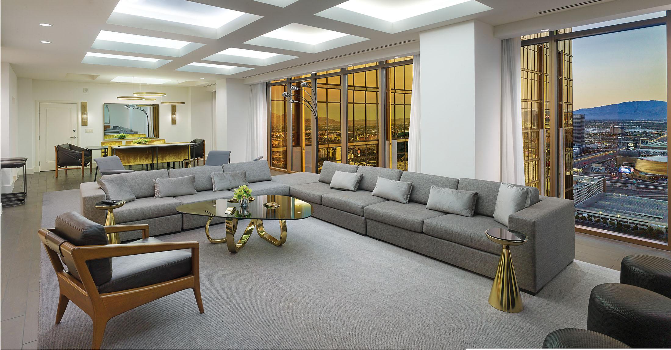 Grey sofas in large living room with view of Las Vegas strip