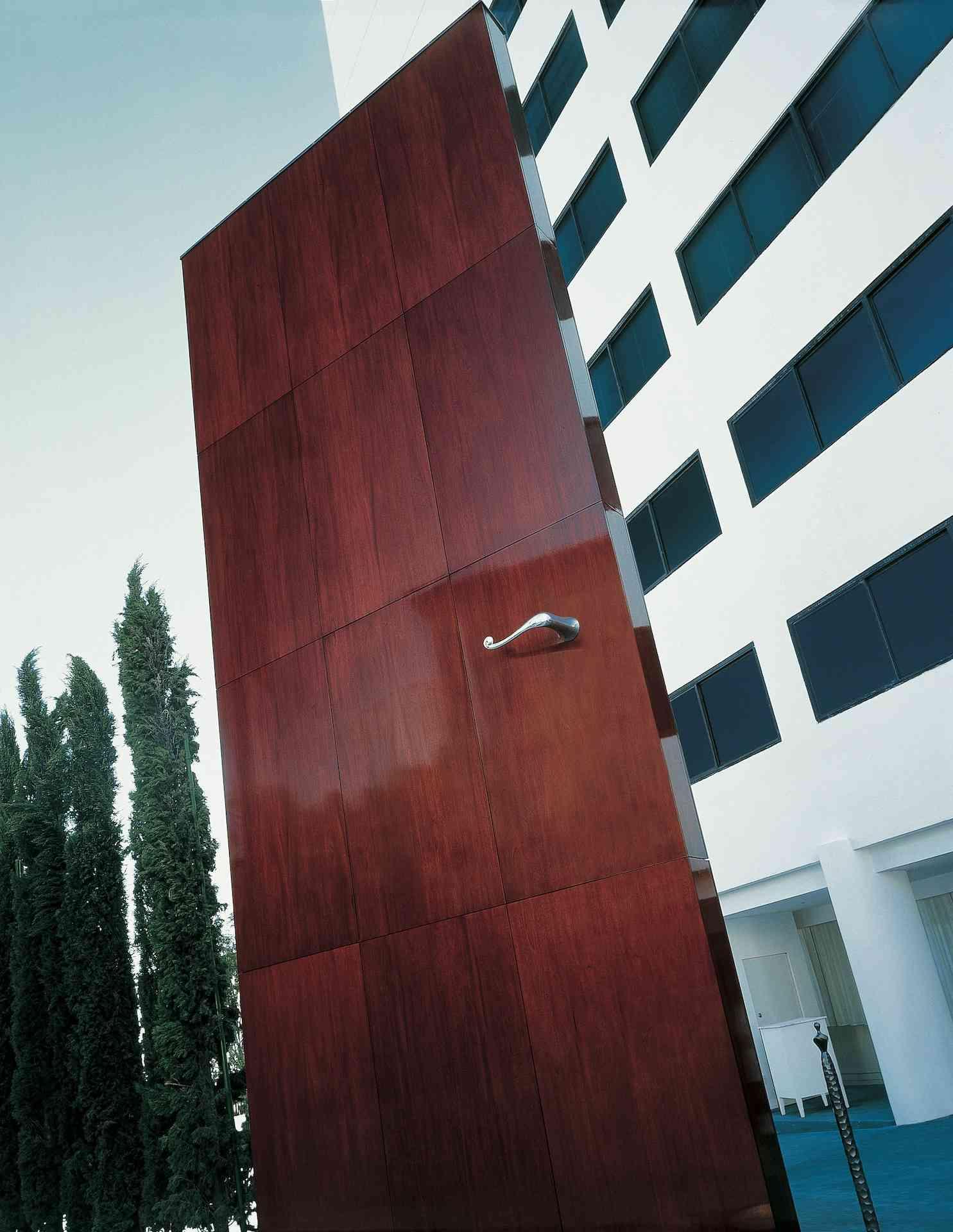 an oversized door outside of a hotel