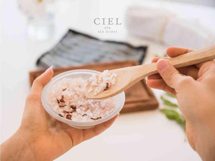 a person stirring a body scrub