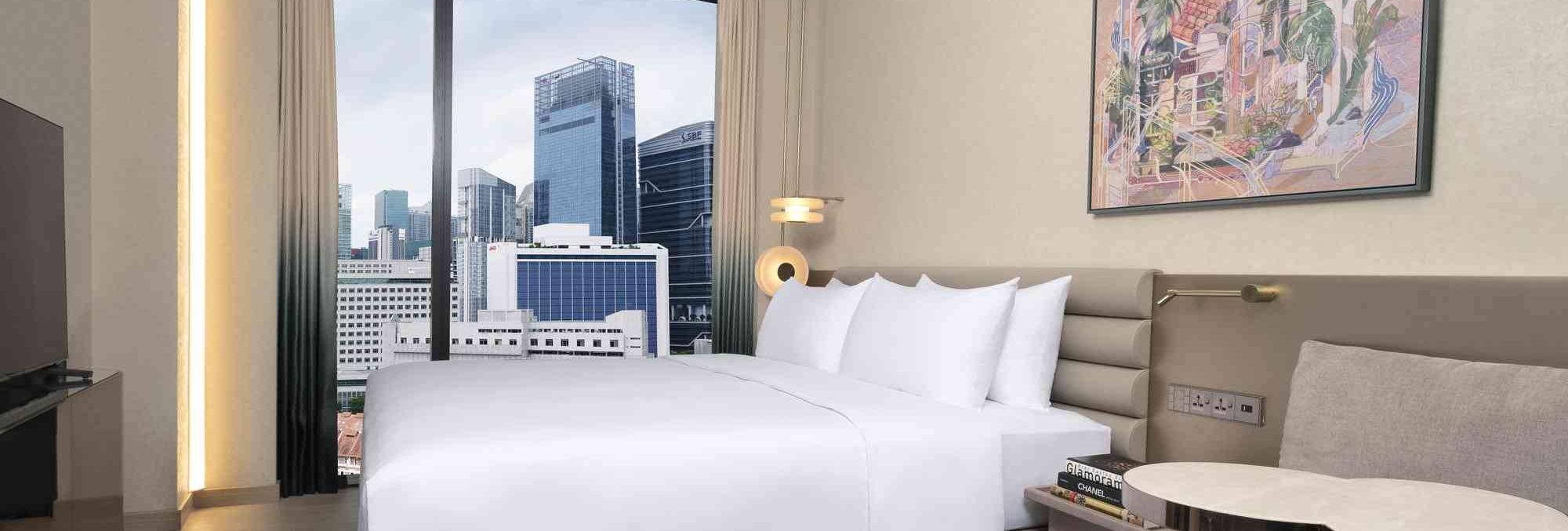 King bed in the Pinnacle Room at Mondrian Singapore