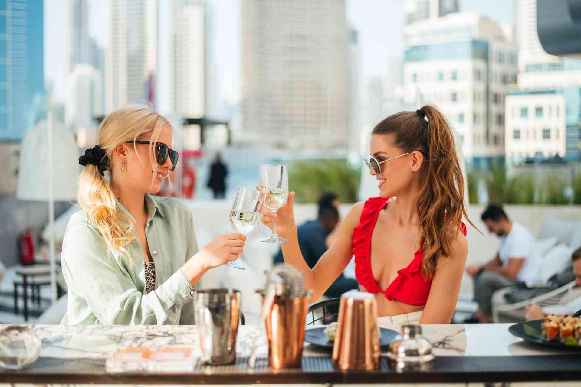 Two Ladies celebrating with wine 