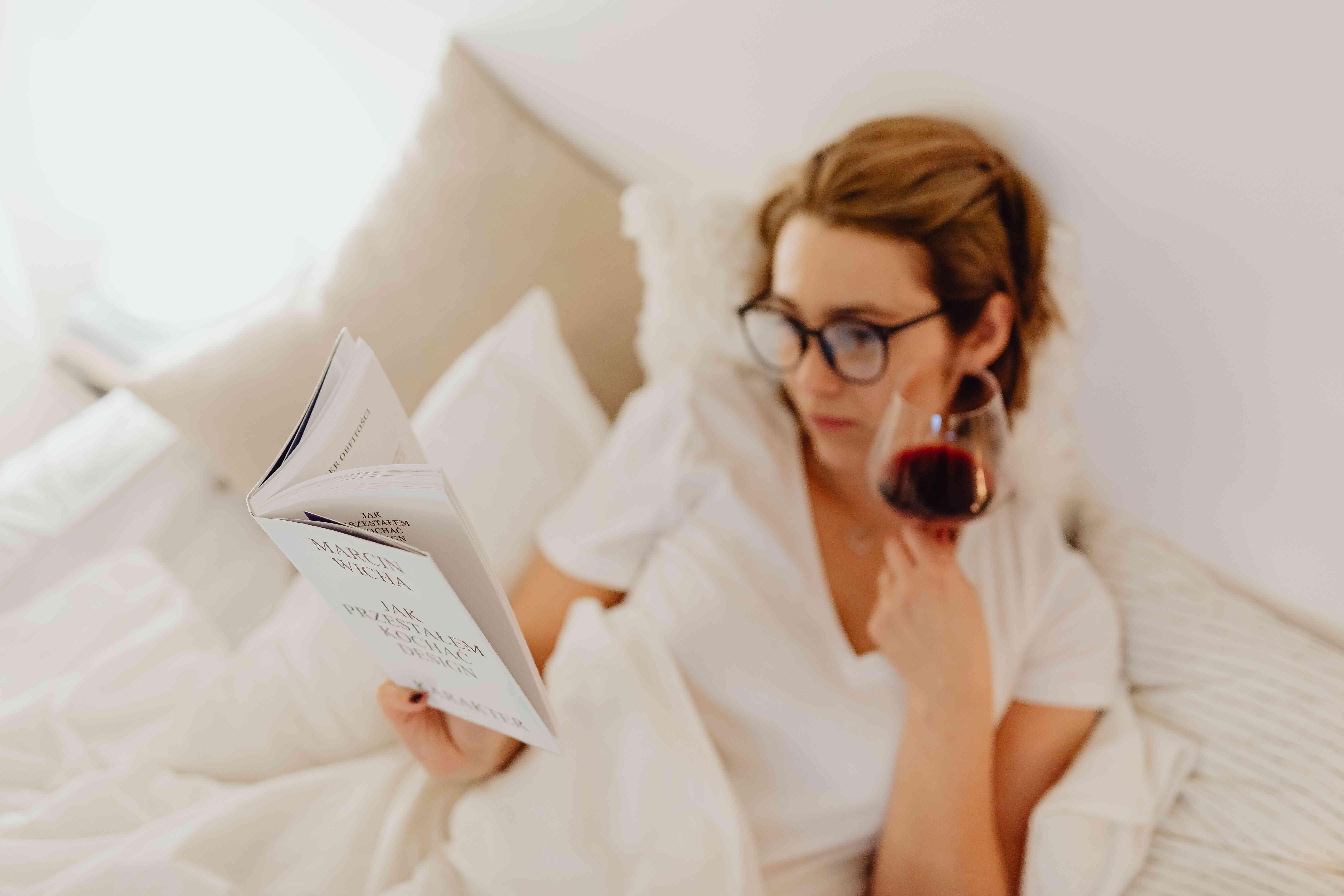 woman in bed with wine 