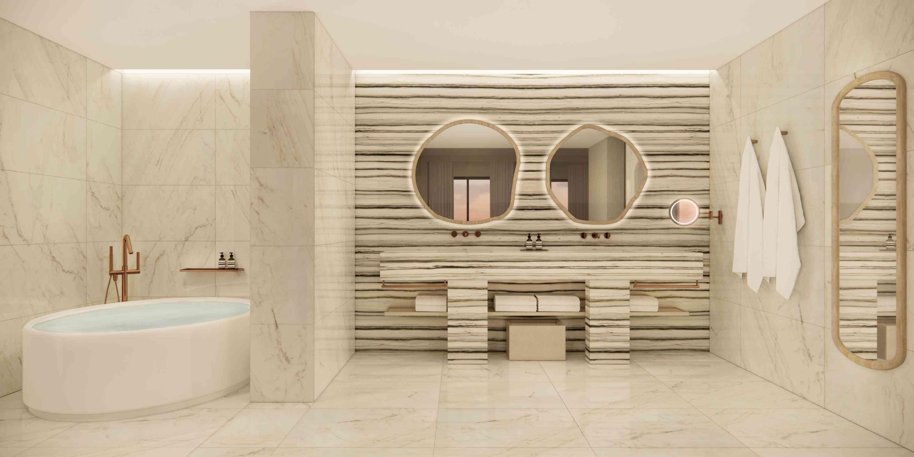 washroom with tub and double sink