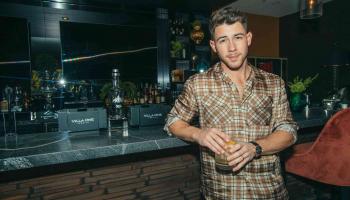 Nick Jonas at a bar
