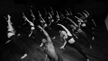 a group of people doing yoga