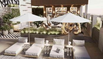 lounge chairs by a rooftop pool