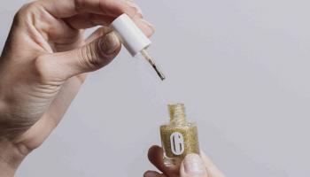 close-up of nails being painted