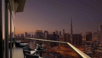 Balcony looking out at Dubai at night.