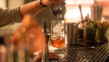 A cocktail being poured 