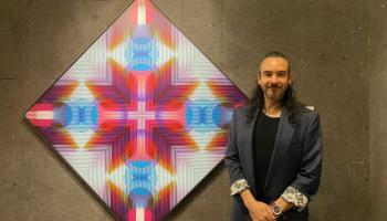 Artist with their geometric painting
